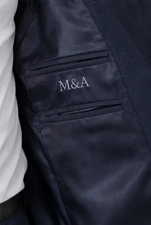 La doublure de la veste, monogrammée
